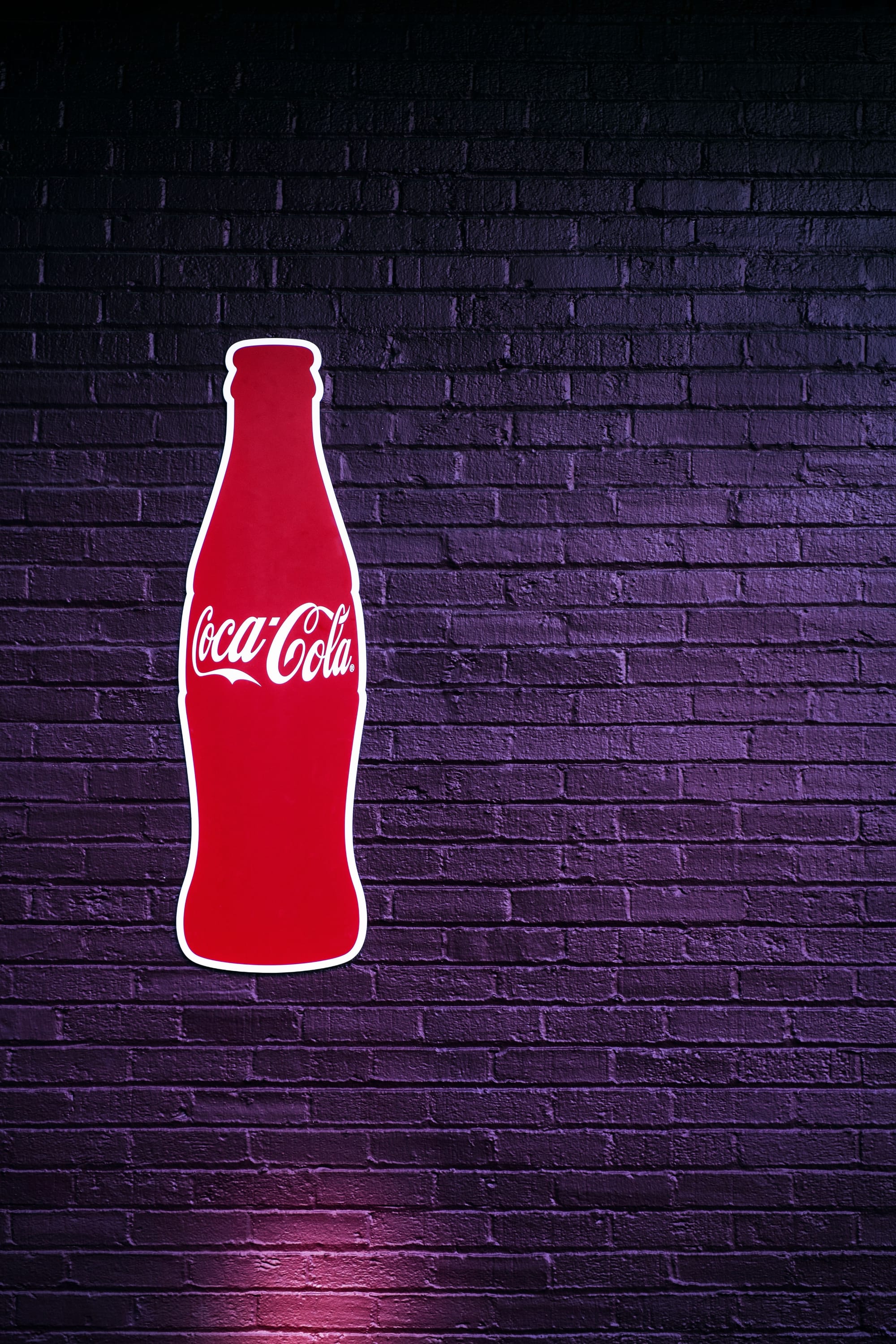 L'Évolution Iconique | Histoire du Logo Coca-Cola, Choix Graphiques et Valeurs