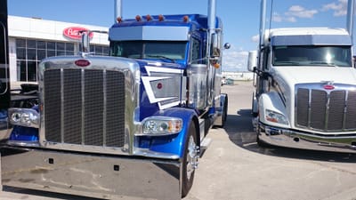 Loading and unloading flatbed trucks at shipping and receiving sites