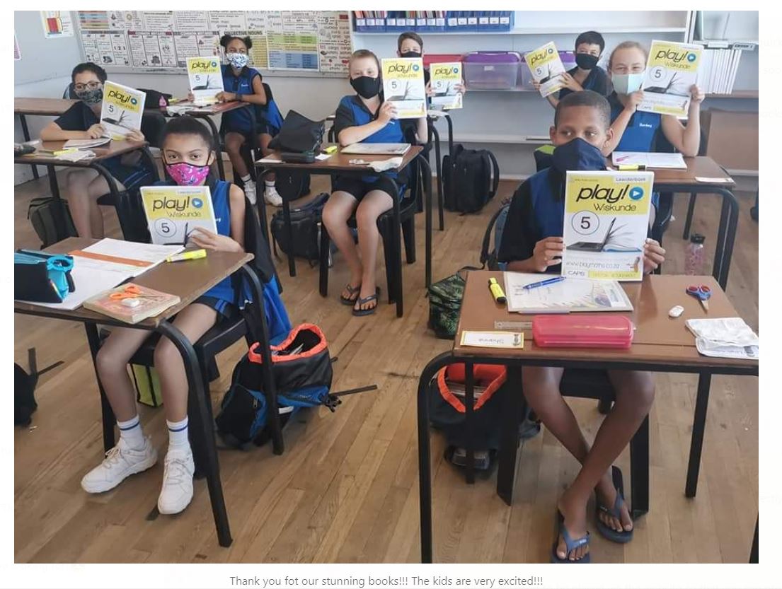 Kids in Classroom holding Books