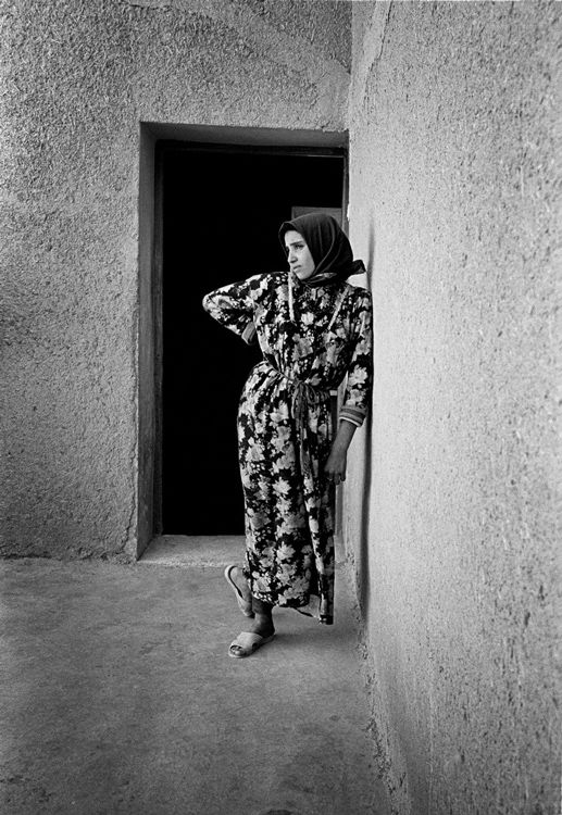 Pierre Choinière - Young adolescent, gracefully posed against the wall of her home, Morocco 2010