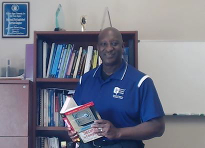 Dr. DeSassure in his office, Tarrant County College, 2017