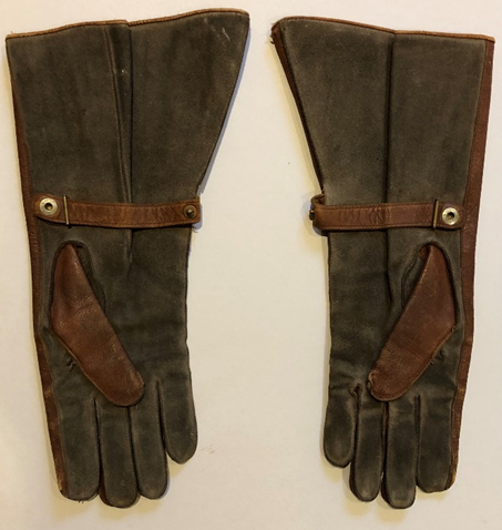 Pair of tan, wrist riding gloves made by Dent, England.