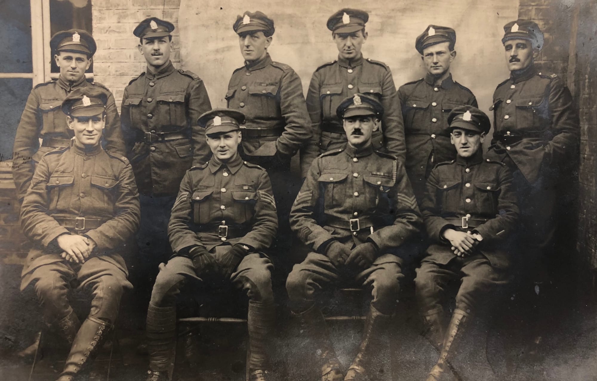 Postcard of the Galloping Section of 2nd Troop, ‘C’ Squadron, (1st) King Edward’s Horse in Service Dress dated to the rear 12/01/1919. The Sergeant (second from the left, front row) and a Private (third from the left, second row) are wearing Military Medal ribbons and the Sergeant (second from the right, front row) is wearing possibly a gallantry ribbon together with several pre-Great War service medal ribbons and three service chevrons for three years overseas service on his right lower sleeve. The 1914/1915 Star medal ribbons were first issued in December 1918 and so it is possible he is wearing one of these. The other medal ribbons for the Great War, the British War medal and Victory medal were not issued until 1919-1920. The Trooper (right hand end, front row) is wearing a brass wound stripe on his left outer forearm. Note that white lanyards are no longer being worn with the Service Dress uniform.
