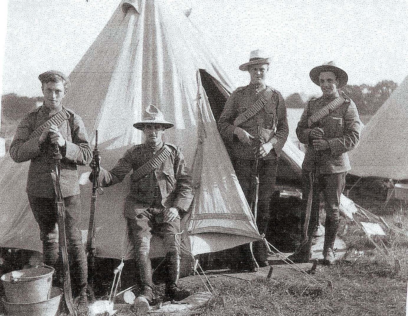 Private Sydney Harris (sitting) and fellow Troopers of ‘B’ Squadron (British American) during the annual camp of the King’s Colonials Imperial Yeomanry wearing different styles of unofficial Undress uniform headdress and Boer War period, 50-round Mills equipment webbing bandolier circa 1905. Private Harris and the Trooper on the far right are wearing a distinctive New Zealand ‘Lemon-Squeezer’ headdress and the Trooper second from right is wearing his Full Dress Sombrero hat with the brim turned up to one side and without the plume of cock’s feathers (Courtesy of Carole McEntee-Taylor. From Colonial Warrior to Western Front Flyer: The Five Wars of Sydney Herbert Bywater Harris. London: Pen and Sword, 2015).
