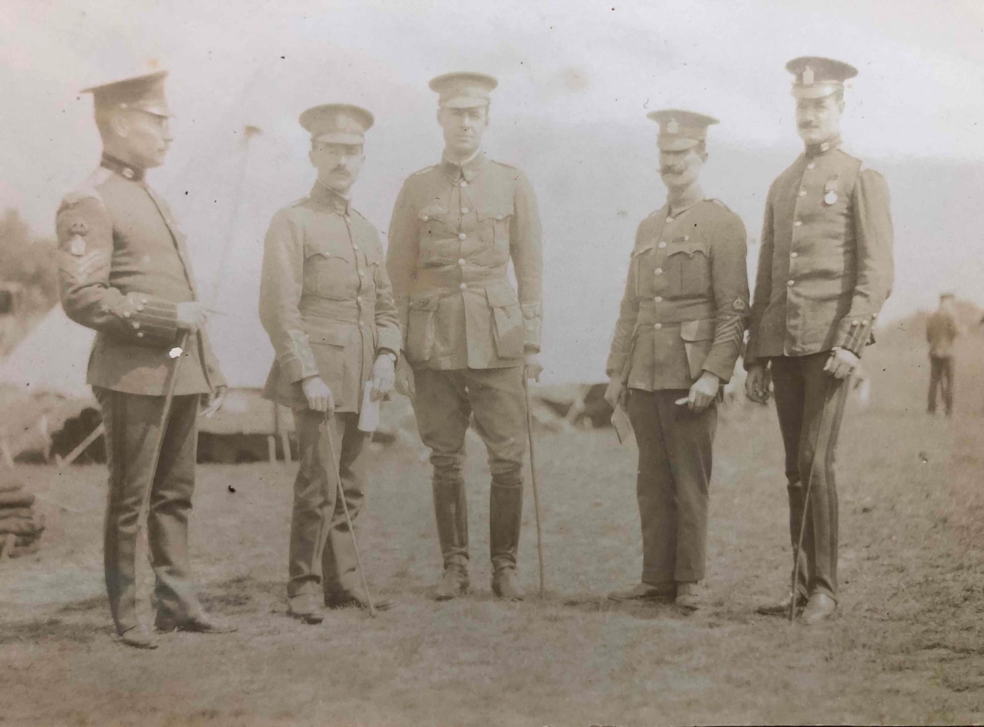 Postcard photograph of (left to right): Squadron Sergeant Major (as per Figures 139-140); an as yet unidentified Captain (three pips on his sleeve rank panel); Lieutenant George Gray Russell; Squadron Quarter Master Serjeant Frederick Willet Skepelhorn (an embroidered crown above four inverted chevrons on both sleeves) and Serjeant G. H. Tiplady, 'A' Squadron wearing a Queen's South Africa medal (?) with multiple bars and 'A' Squadron King's Colonial's collar badges. The postcard dates to between 1912 and August 1914.