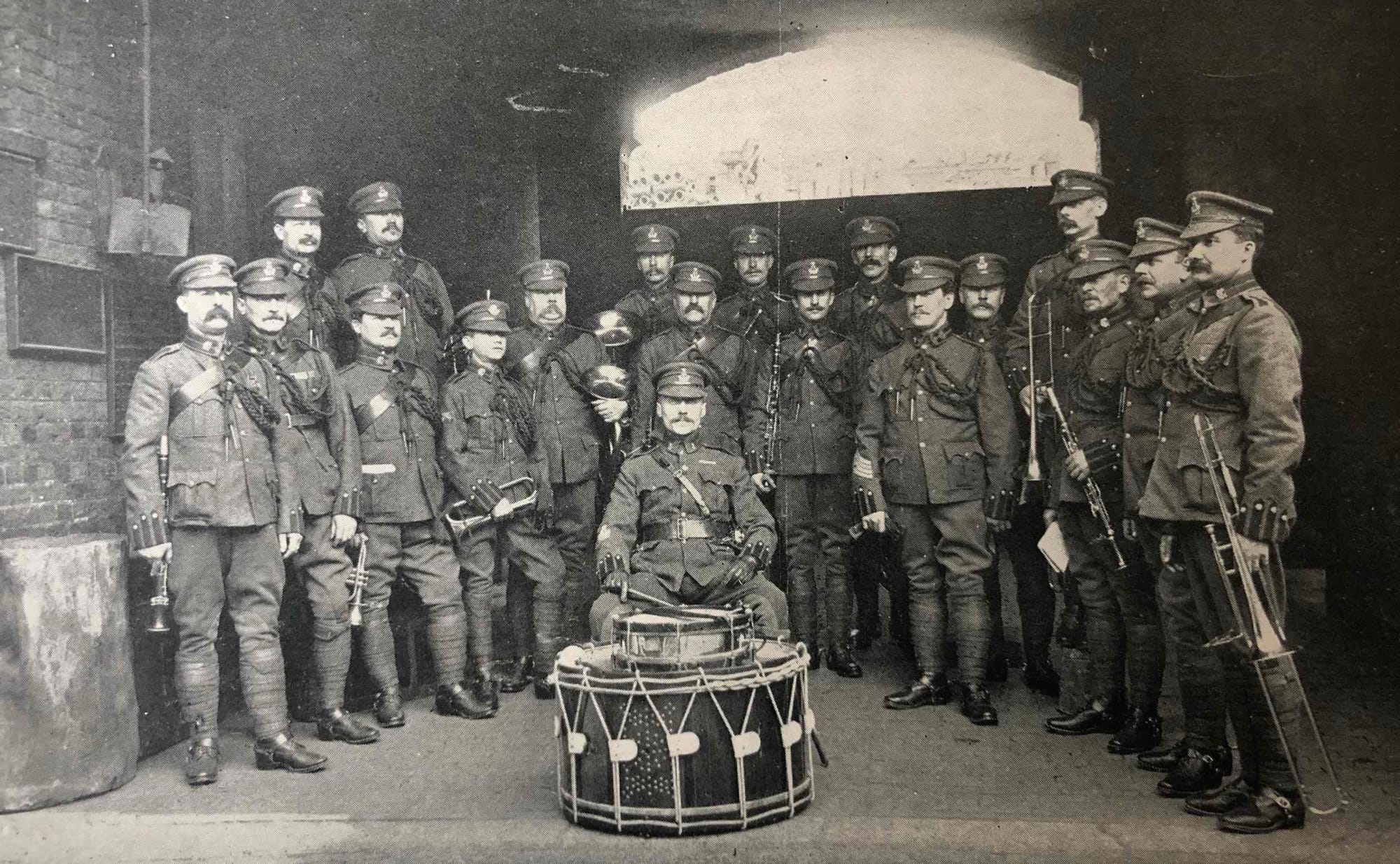 Band of the King’ Colonials led by Trumpet Major Peter Anderson, Bandmaster (second from left) in Undress uniform 1902 (Navy and Army Illustrated. London: Elliot & Fry, Volume XIV: Number 274, 147-148, May 3rd 1902).