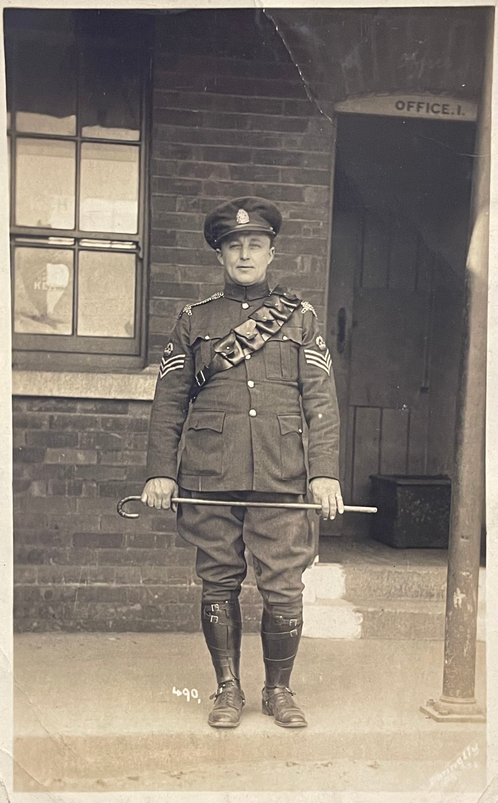 Unknown Squadron Serjeant Major outside a 2KEH Office with 2KEH sign in the window (1914-17)..