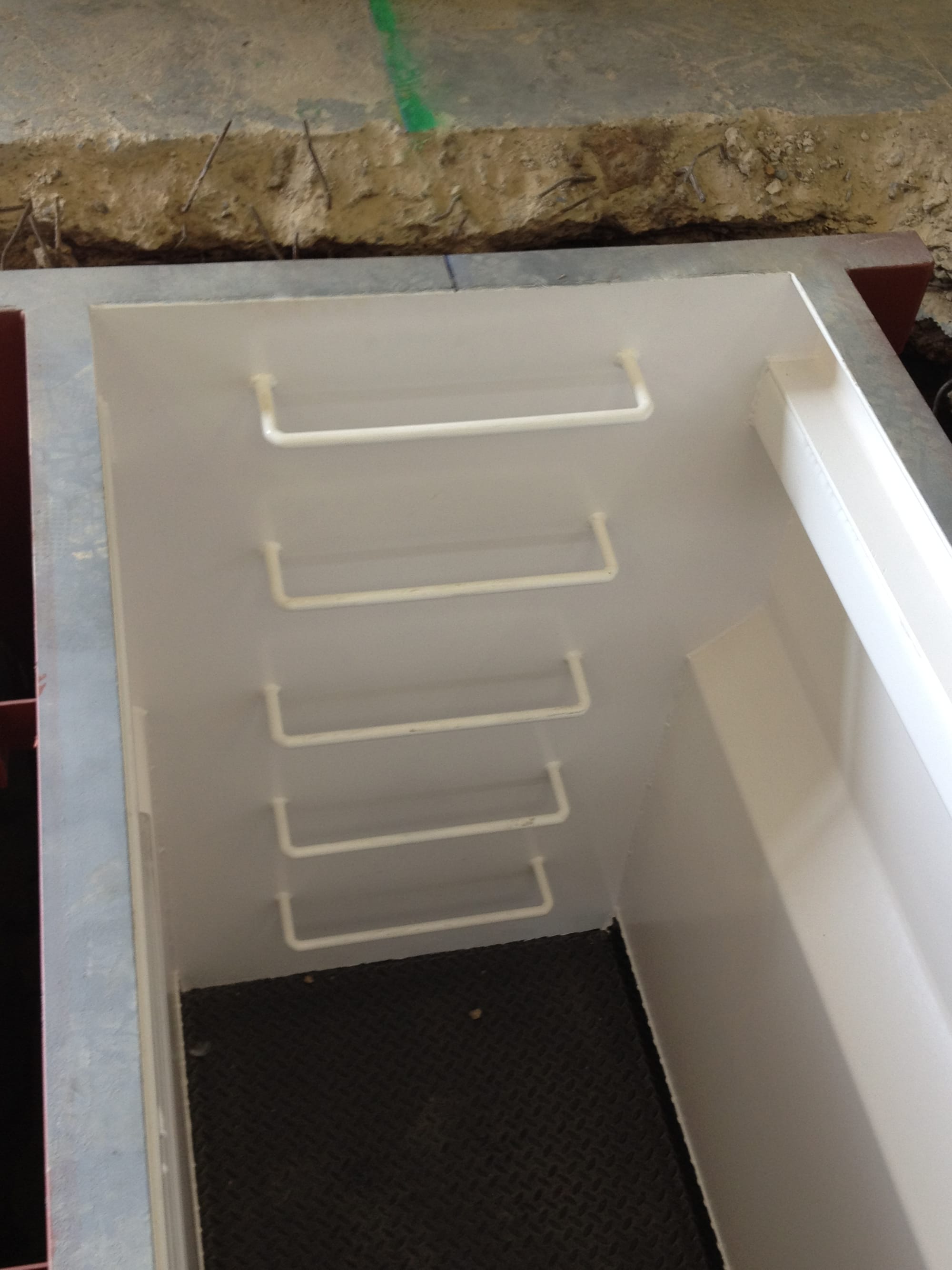 Emergency exit staircase at other end.