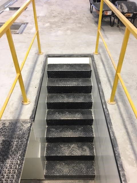 Entry steps fitted with safety bars around area.
