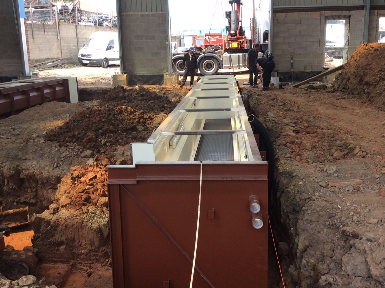Both pits being installed and aligned to centre of doorways.