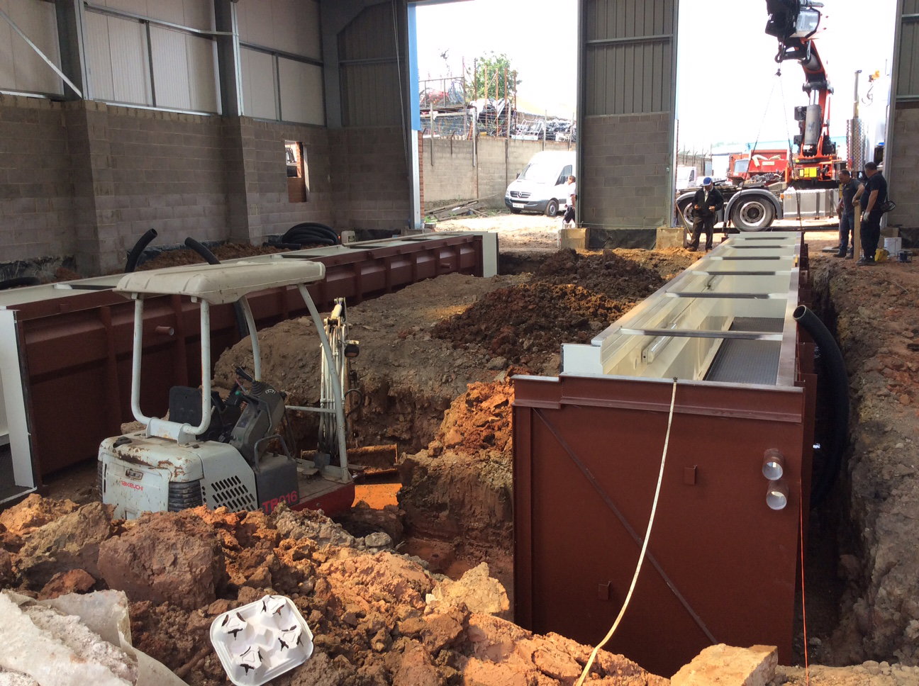 Two inspection Pits, side by side but linked both ends by access tunnels and steps.