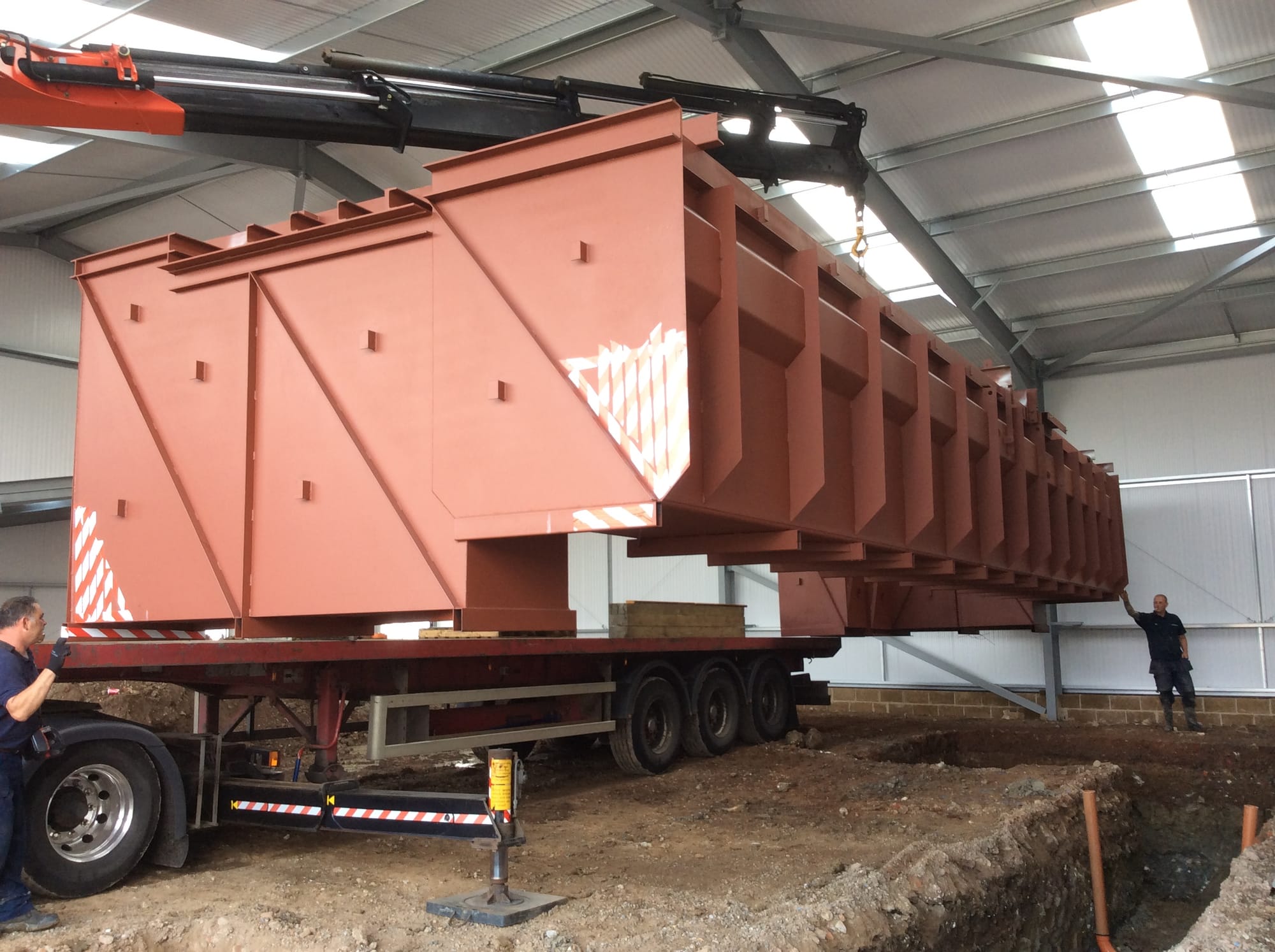 Manouver inspection pit over prepared recess.