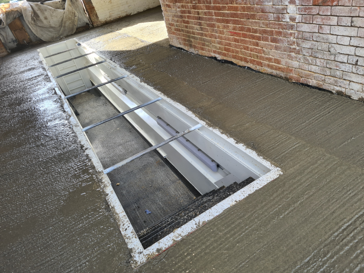 Floor levels were made concrete poured and screeded and left to cure.