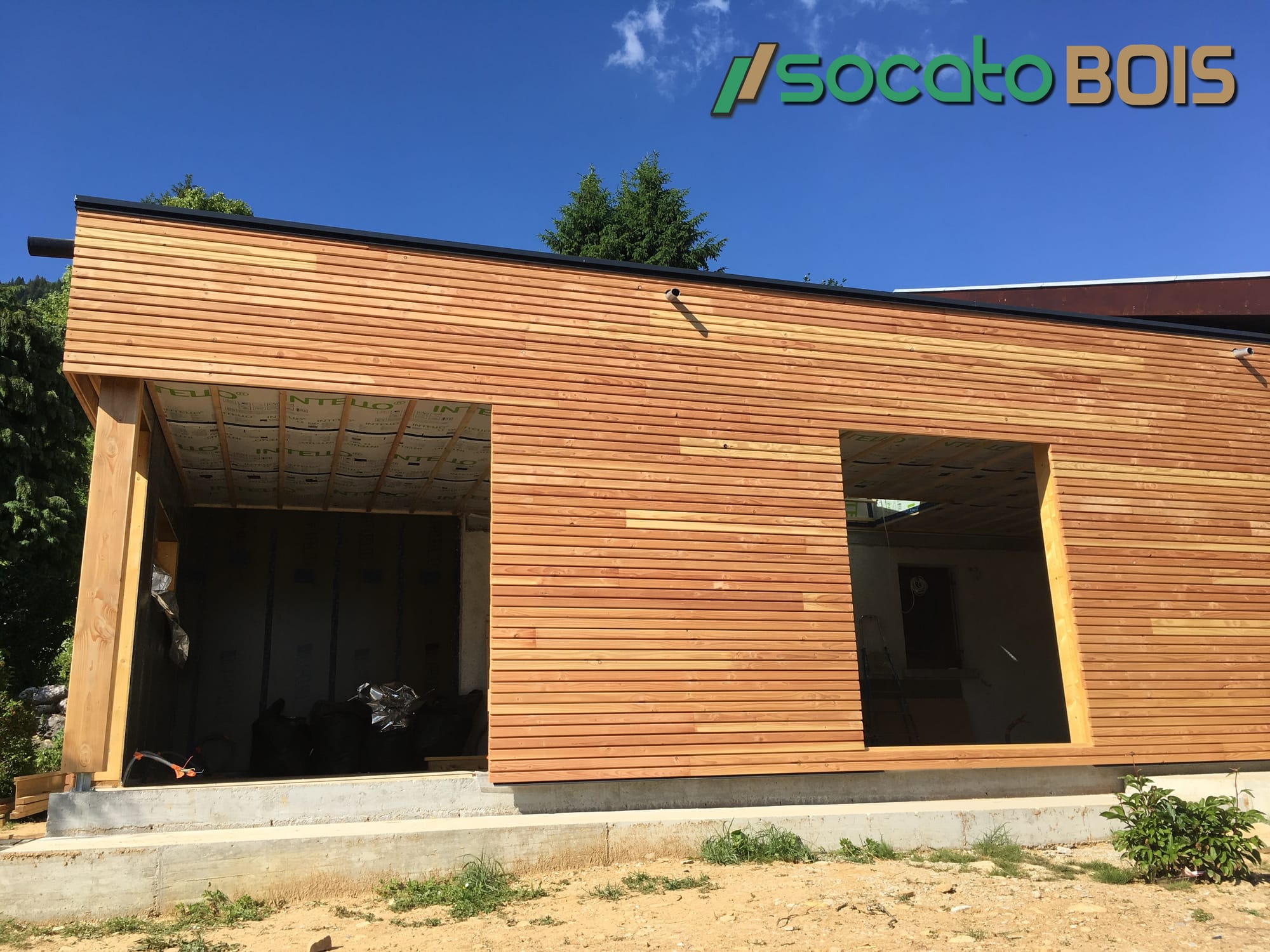 Extension ossature bois bardage claire voie membrane EPDM