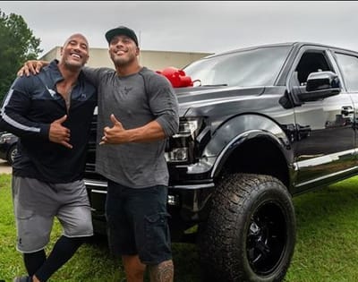 Here's the moment Dwayne Johnson surprised his cousin and longtime stunt double, Tanaoi Reed, with a car gift that brought him to tears