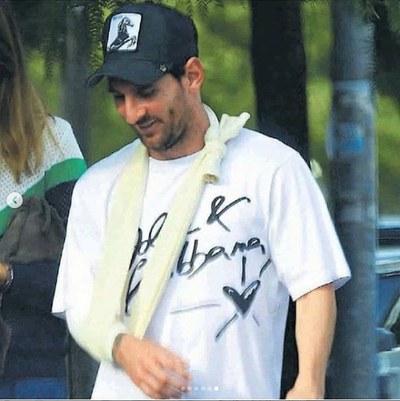 Injured Lionel Messi pictured wearing sling for the first time after breaking his arm (Photos)