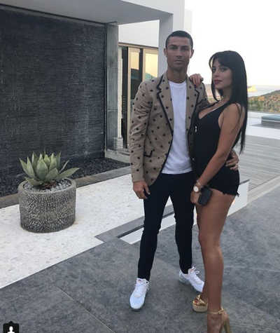 Loved-up photo of Cristiano Ronaldo and his partner Georgina Rodriguez as they step out for a date together.