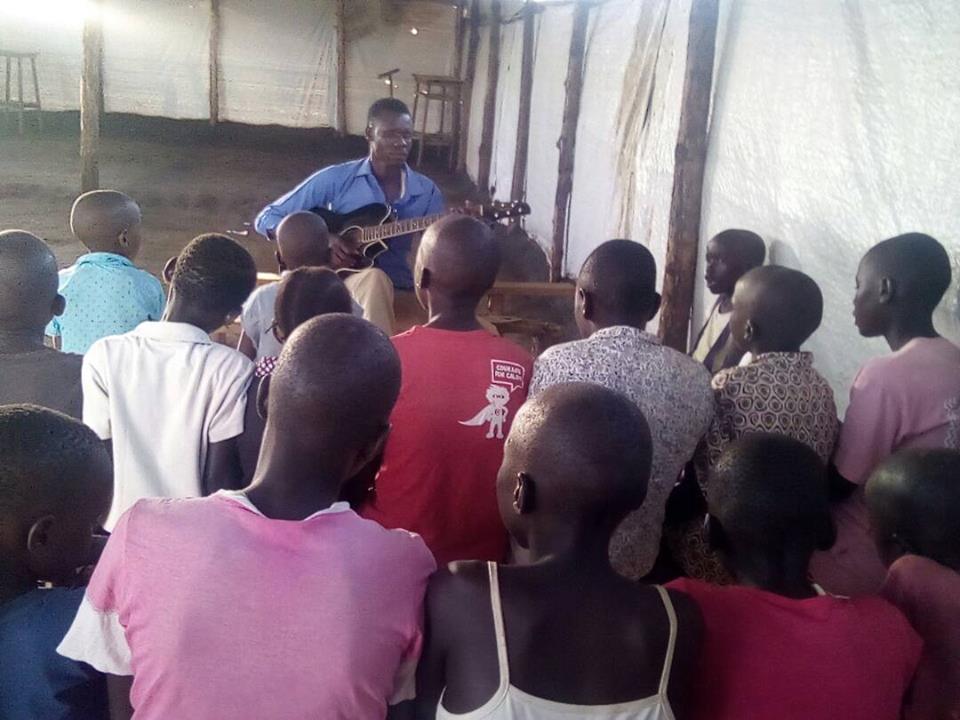 Our Secretary Seme Ludanga Training the Children