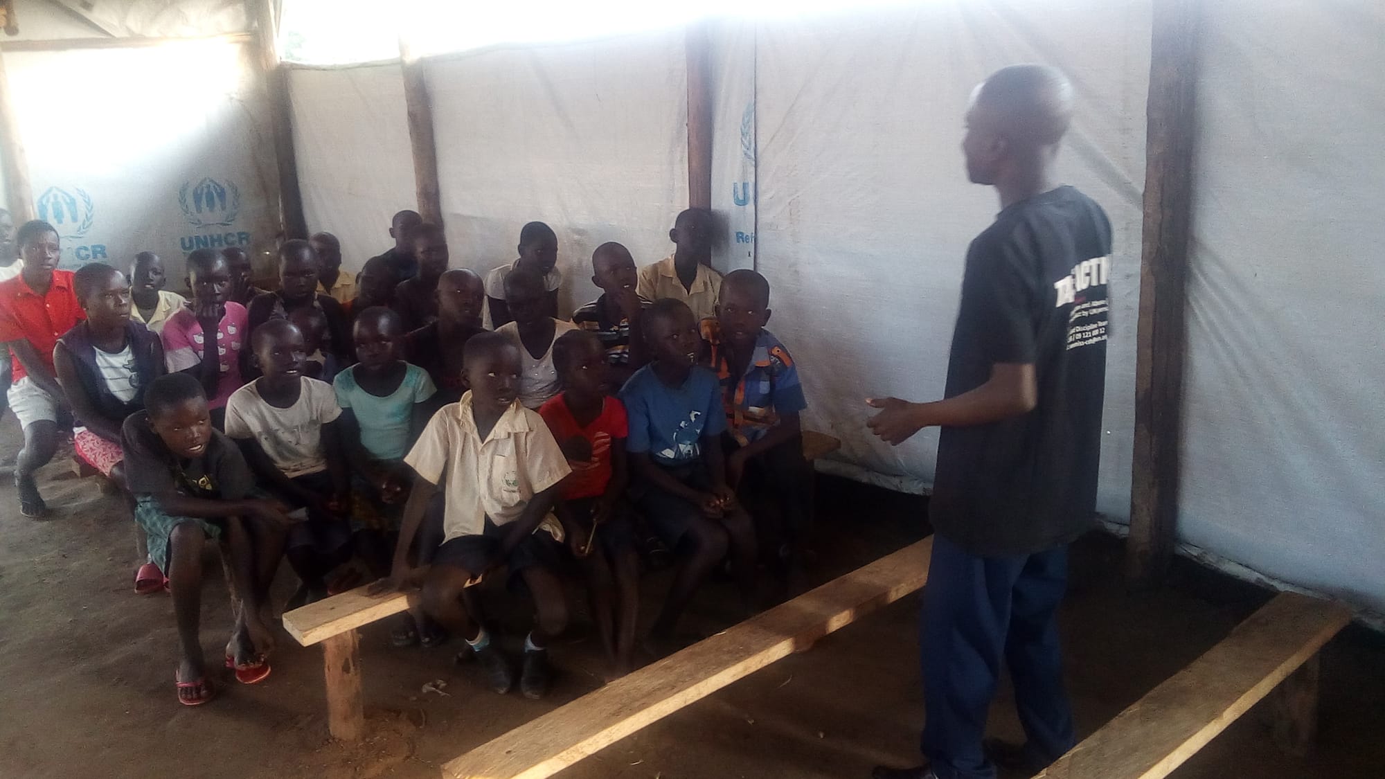 Mr Stephen Wandu teaching the children new song