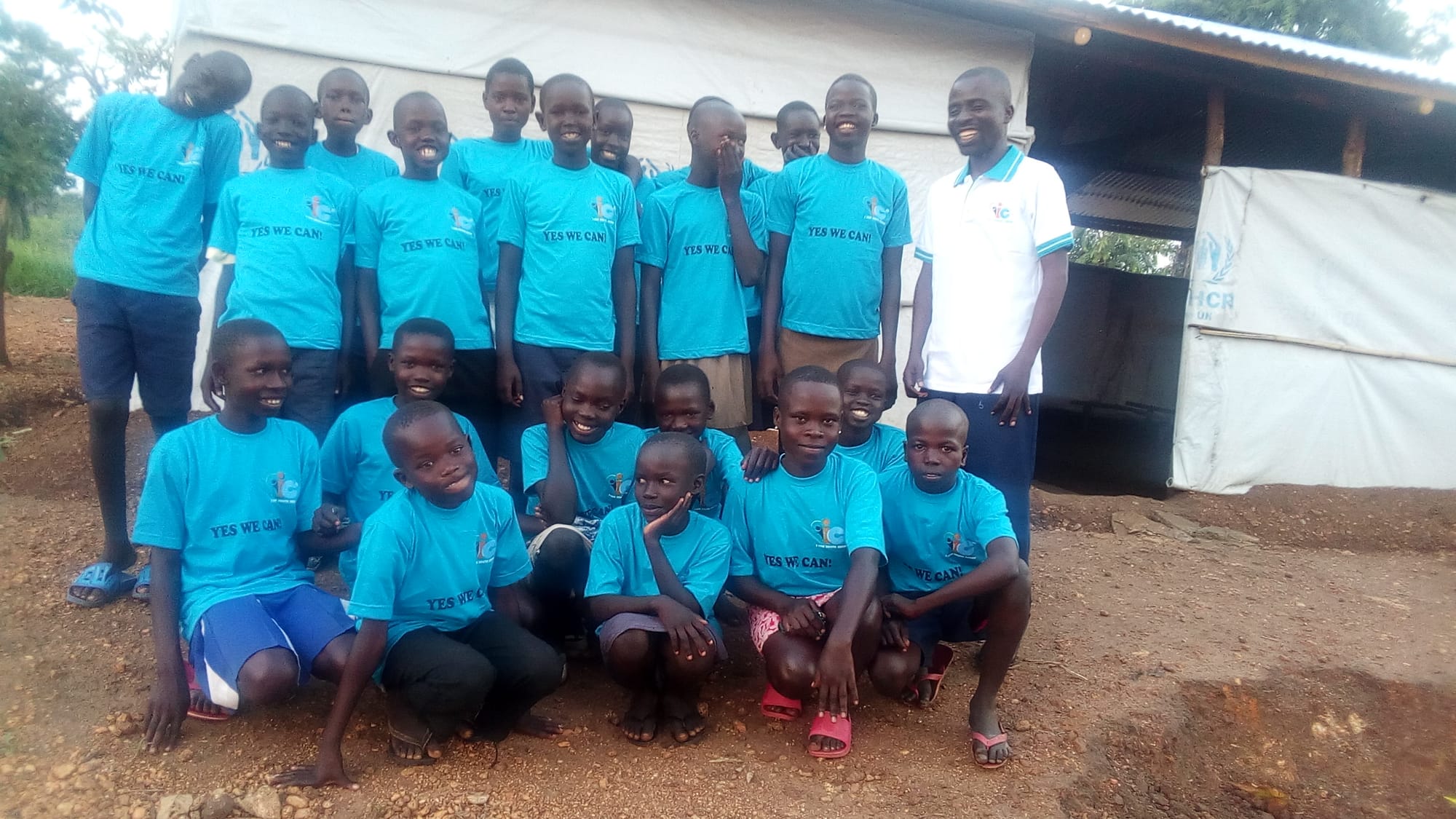 Mr. Stephen Wandu take group picture with I CAN children