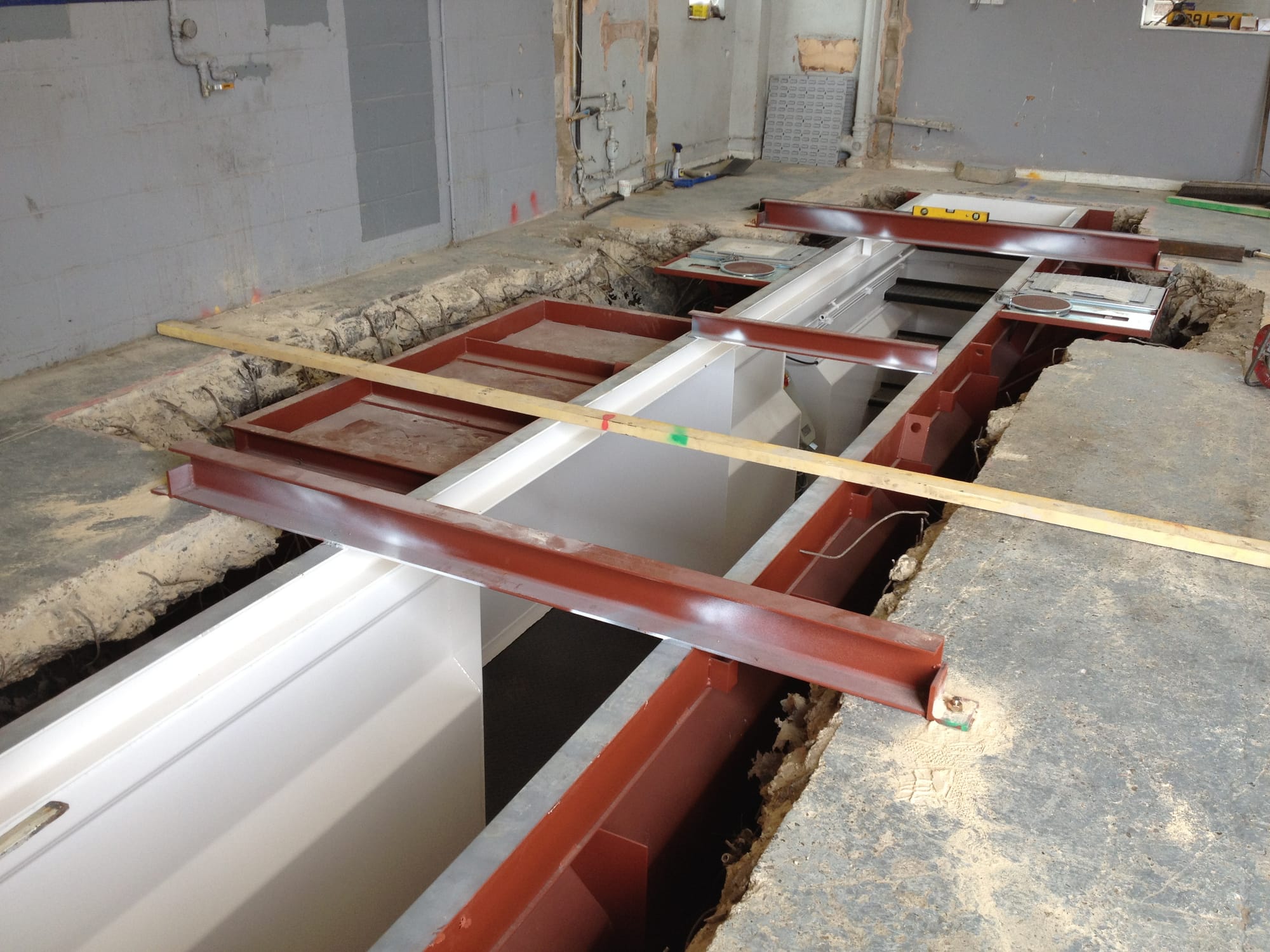 Prefabricated one-piece steel inspection pit in position.