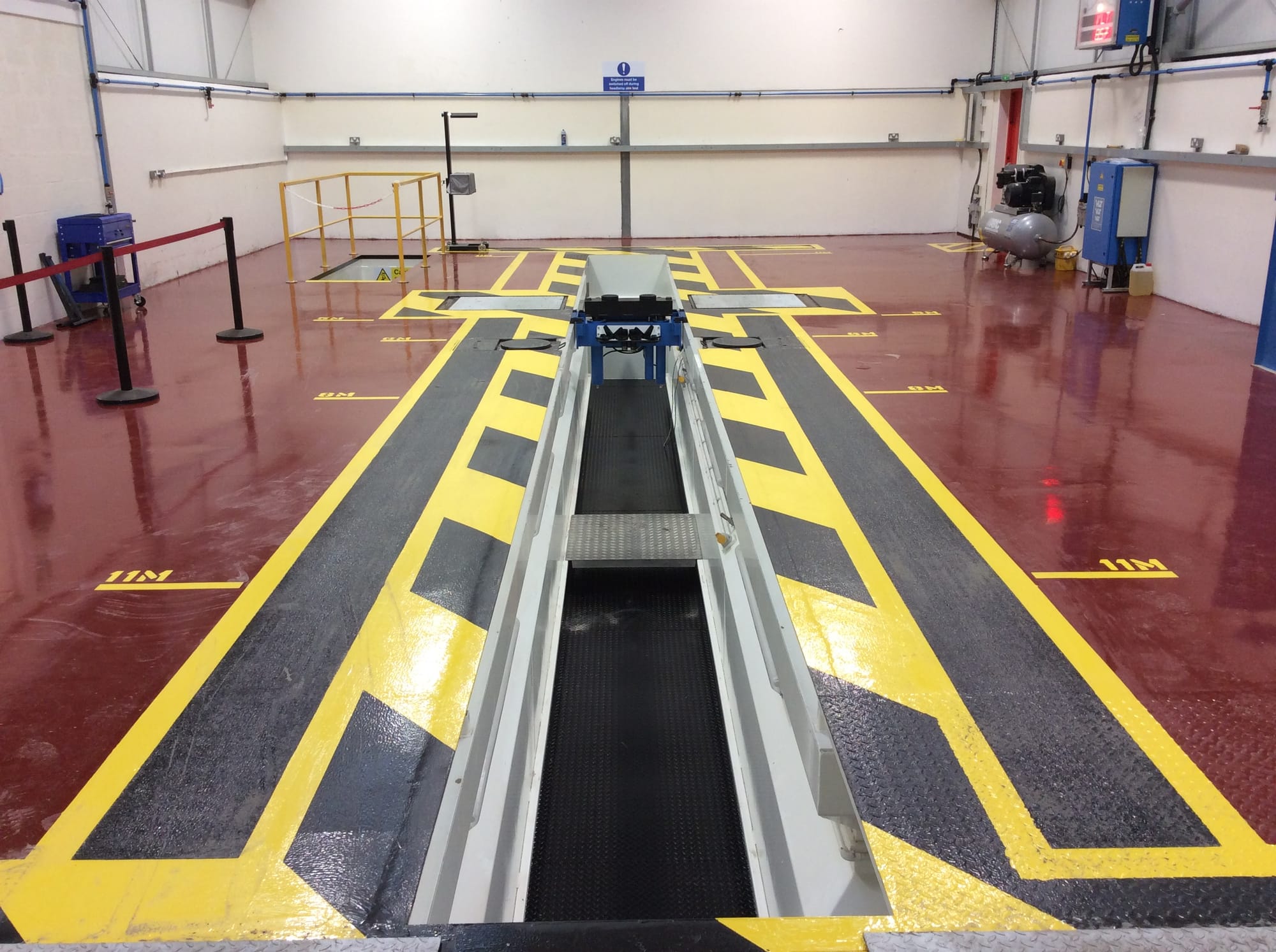 Resin finished floor with required DVSA markings.