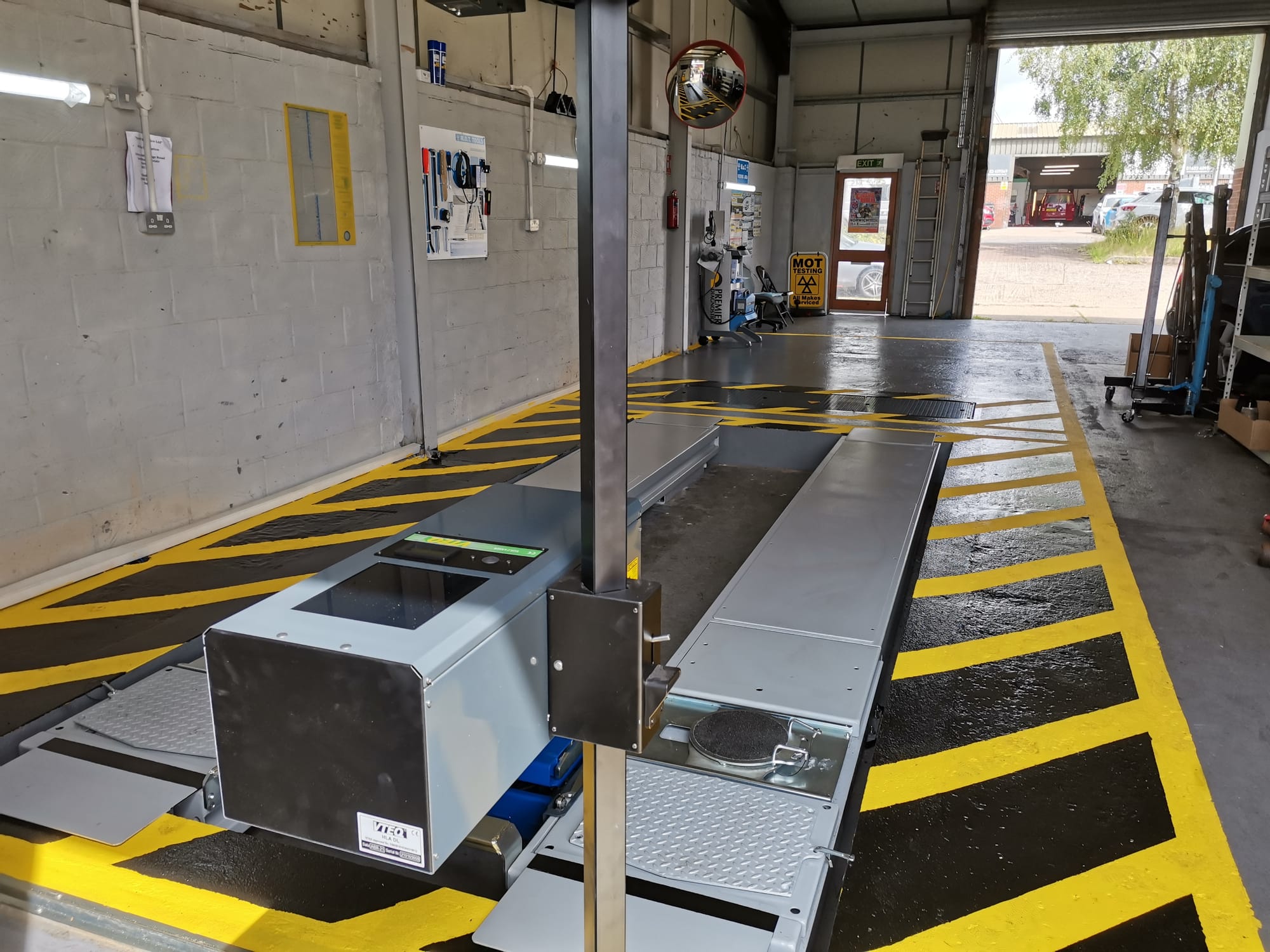 Scissor Lift used to enable smallest MOT Bay footprint.