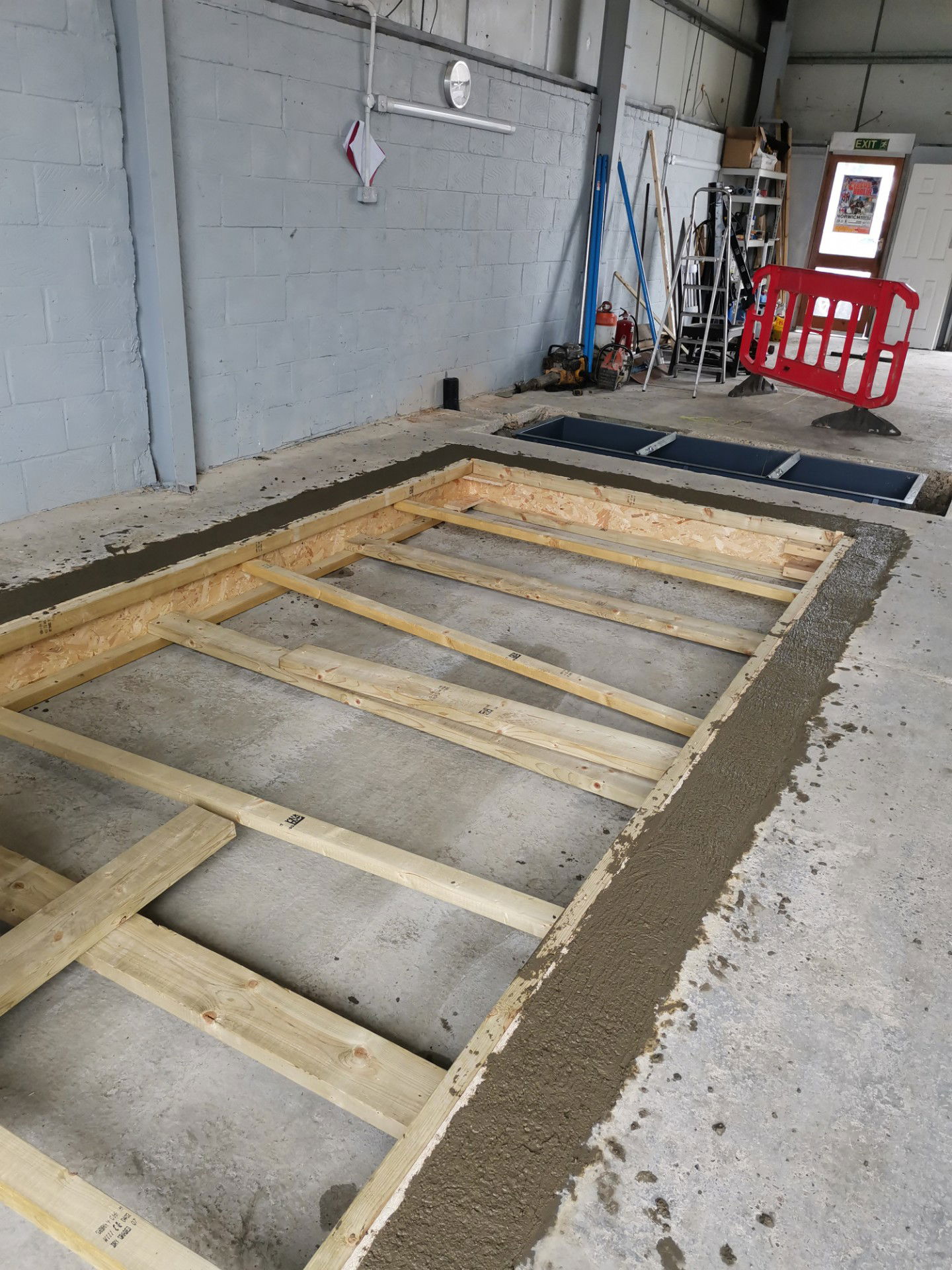 Prepare shuttering and pour concrete sidewalls.