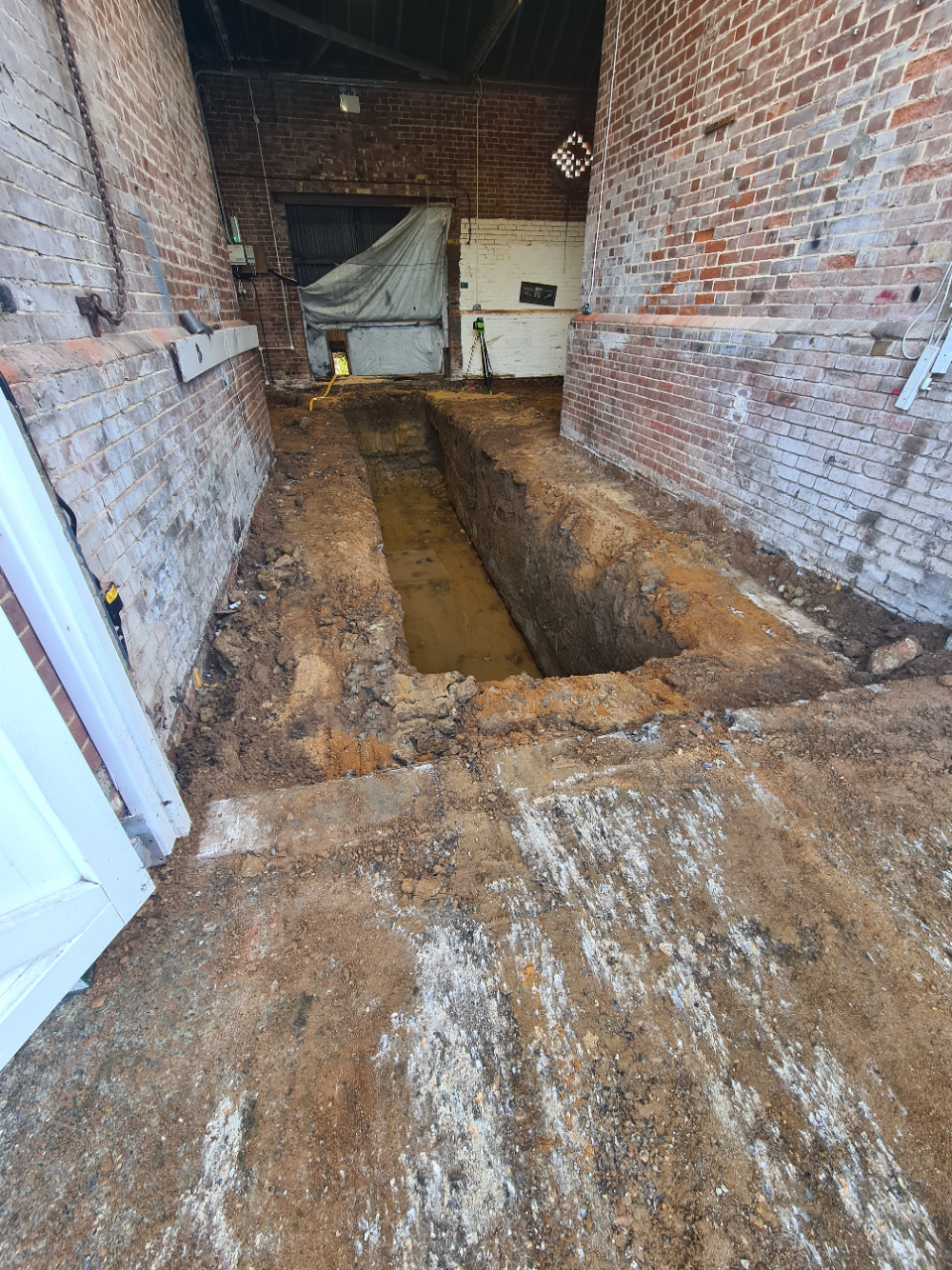 The barn was ancient and the foundations when it was built were minimal so digging down two metres inside the building would certainly weaken everything including the foundations.