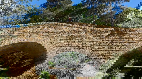 Large bridge construction for vehicle access to exclusive private residence