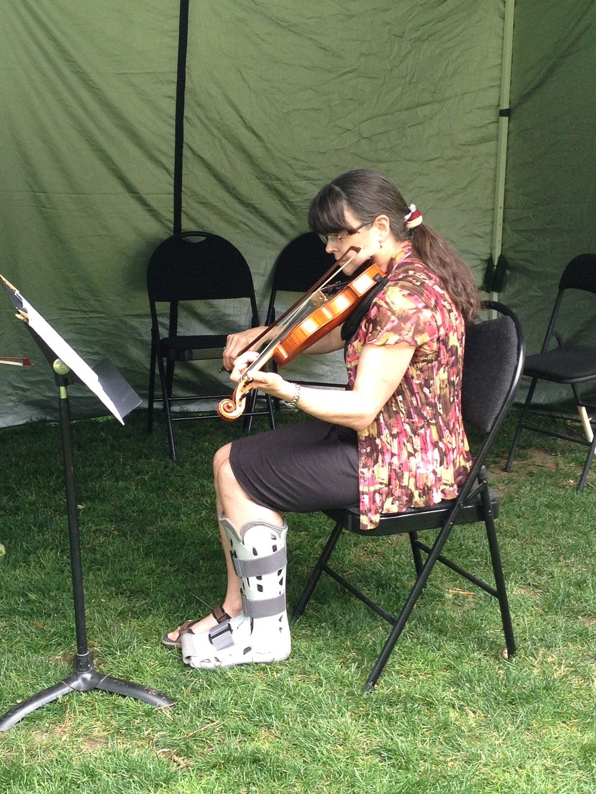 Pam at summer camp in Nelson - good thing you don't need your leg to play violin!