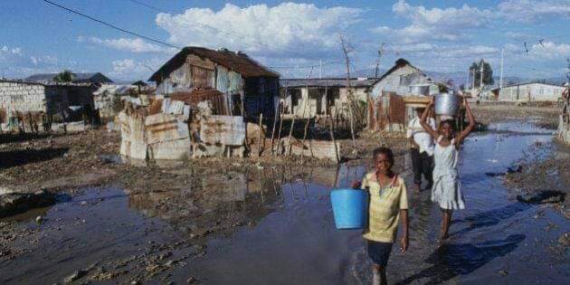 Boy with a 5 gallon jar out to go get water