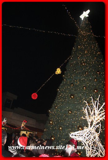 عسفيا تختفل باضائة شجرة عيد الميلاد المجيد