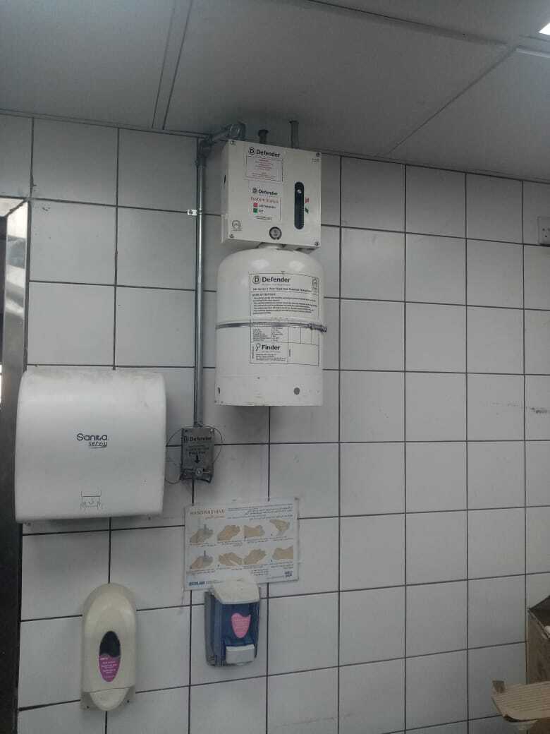 Fire suppression system for kitchen hood