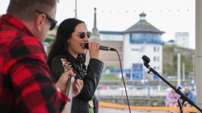 Wind farm funding supports return of free live harbour music sessions