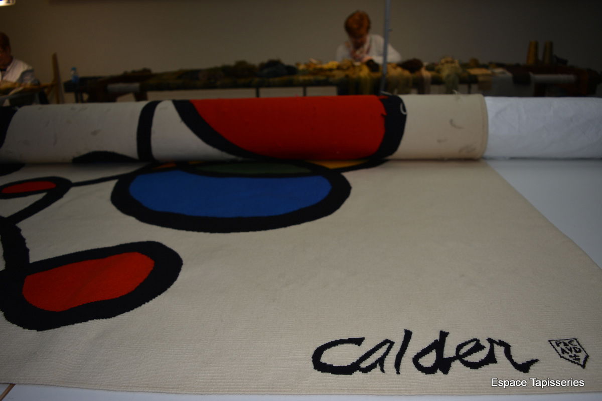 Restauration d'une tapisserie d'apres A. Calder