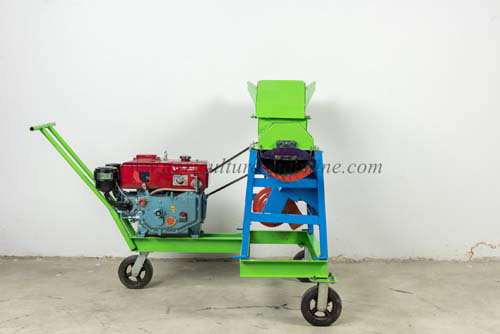 How to clean up the debris on the corn thresher?