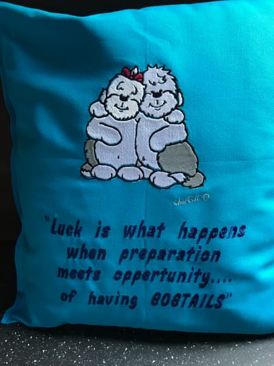 pillow with cuddly bobtails and text