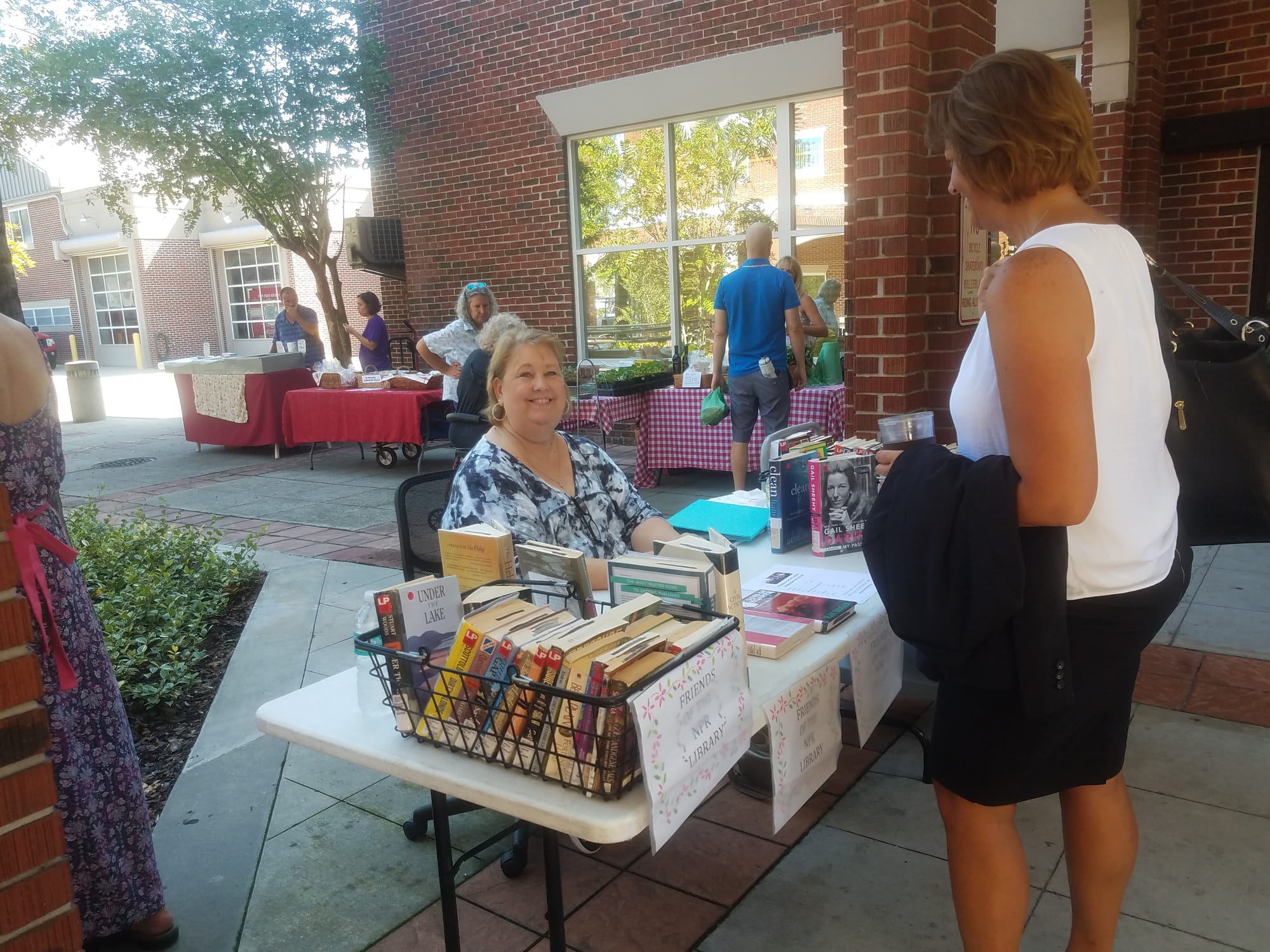 Liz Molinari volunteering at FOL table for Tasty Tuesday at the Library