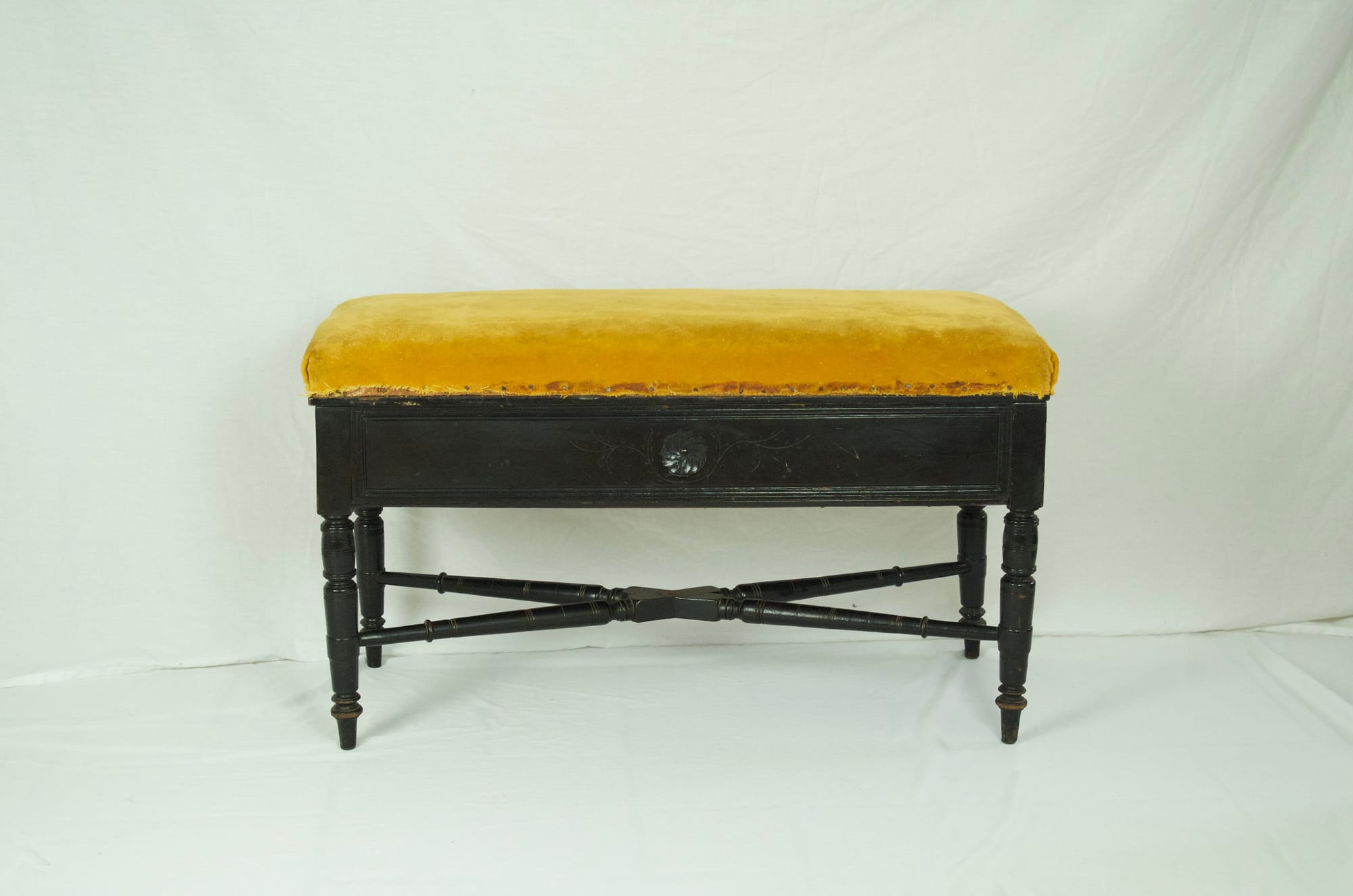 Aesthetic Movement storage seat on turned legs.