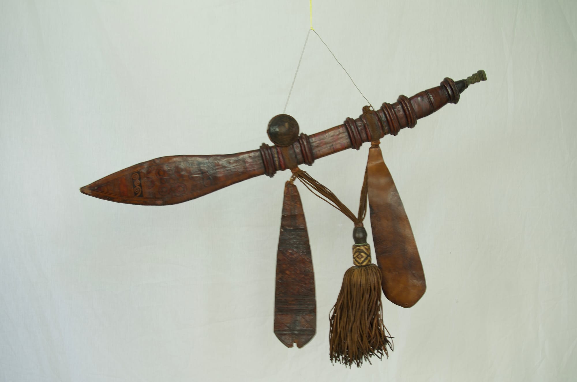 Antique Mandingo sword with decorated leather sheath.