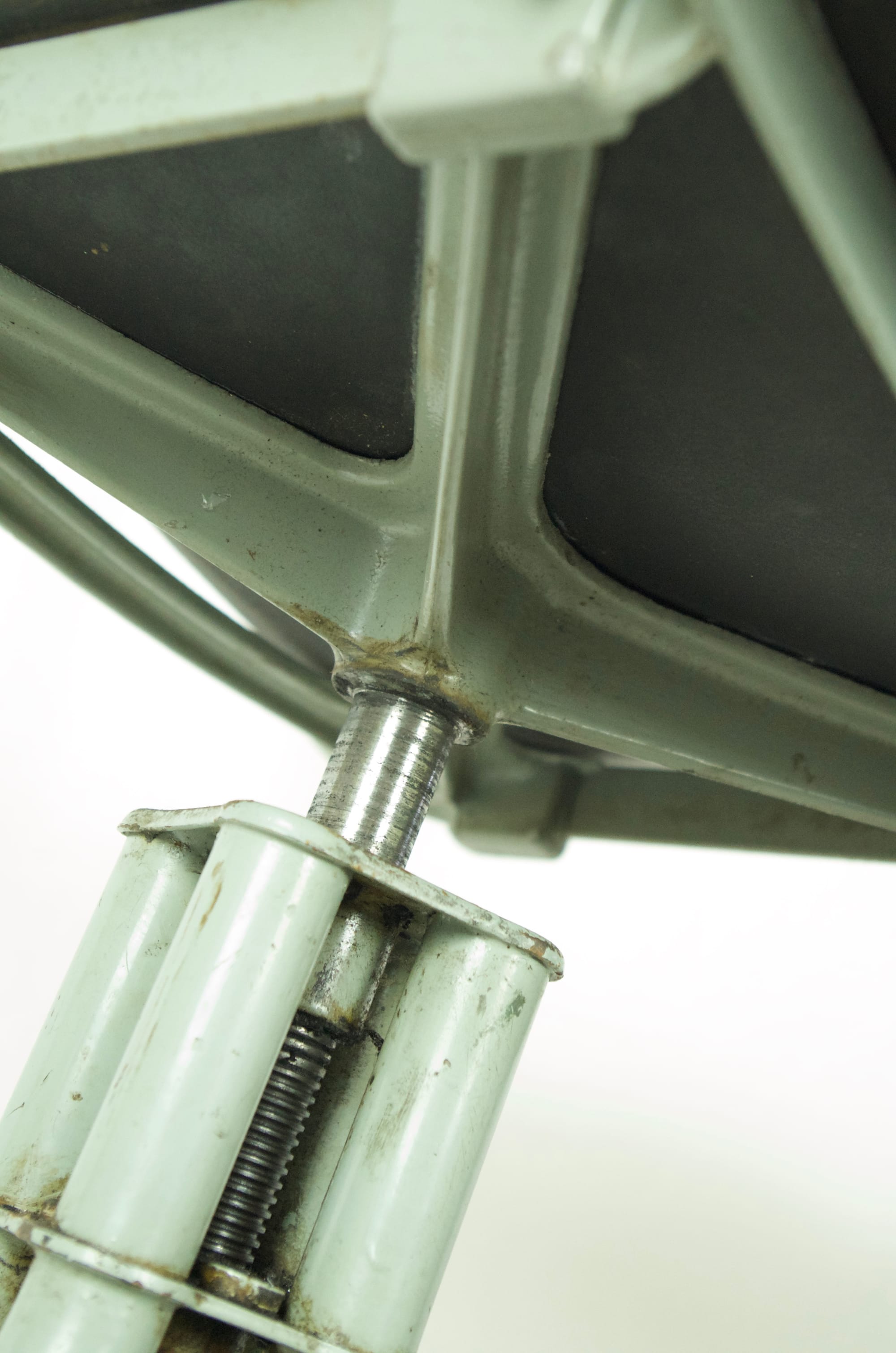 A Pair of vintage Industrial factory chairs On Rollers.