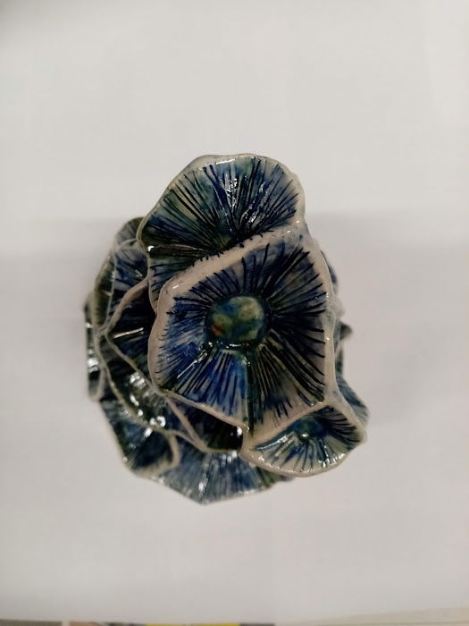 Stoneware. Handbuilt with iridescent blue and green glaze colours