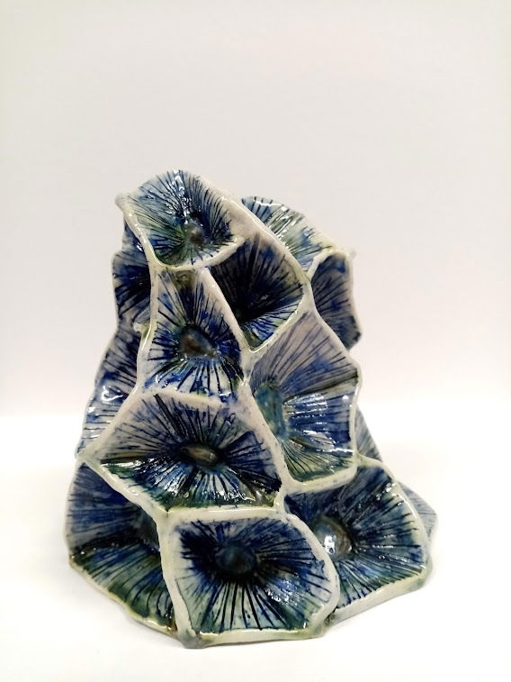 Stoneware. Handbuilt with iridescent blue and green glaze colours