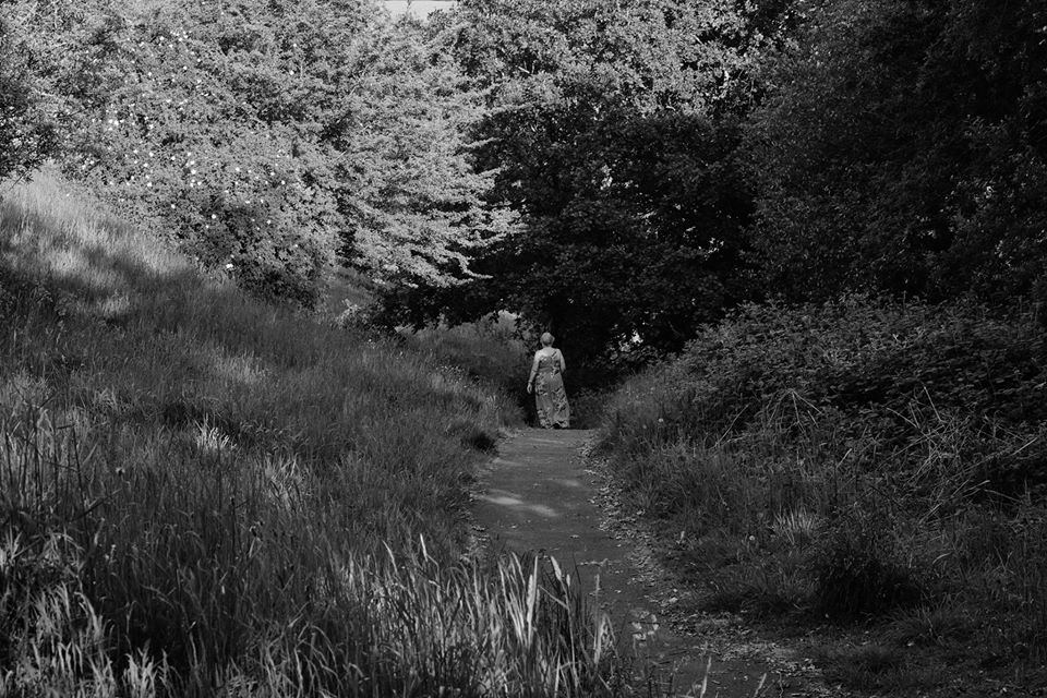 A woman out for a stroll in the sun. - Tony De Sarzec