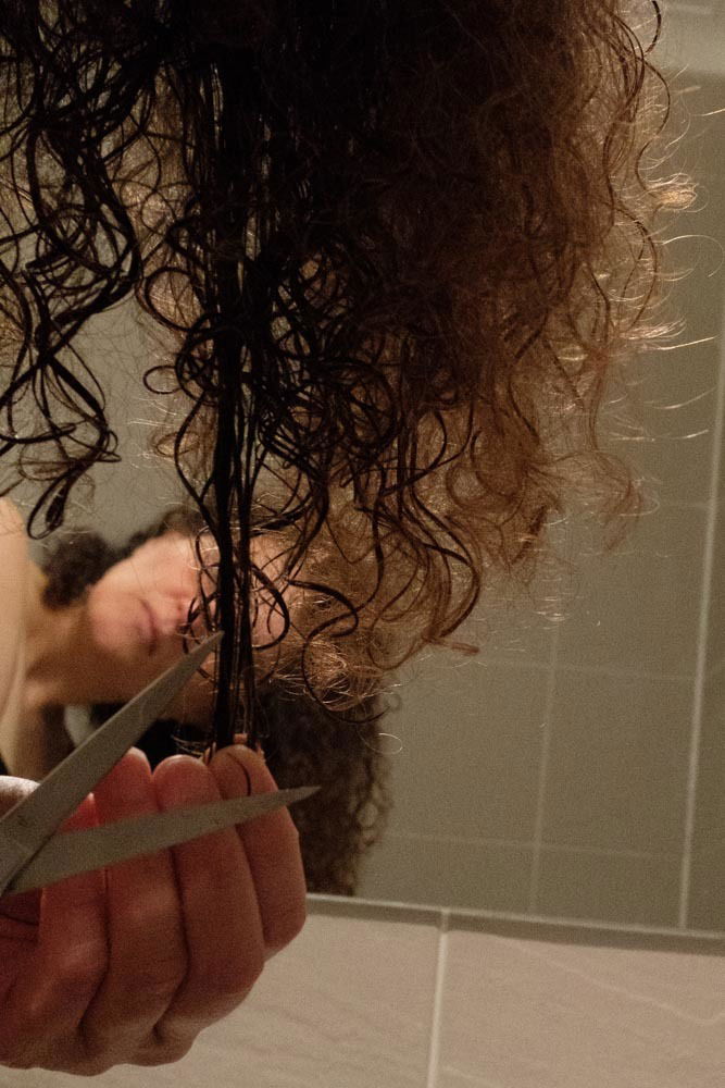 Trying to make the break with some of the old ways of living... and trying to cut my own hair... - Emilie Grand-Clement