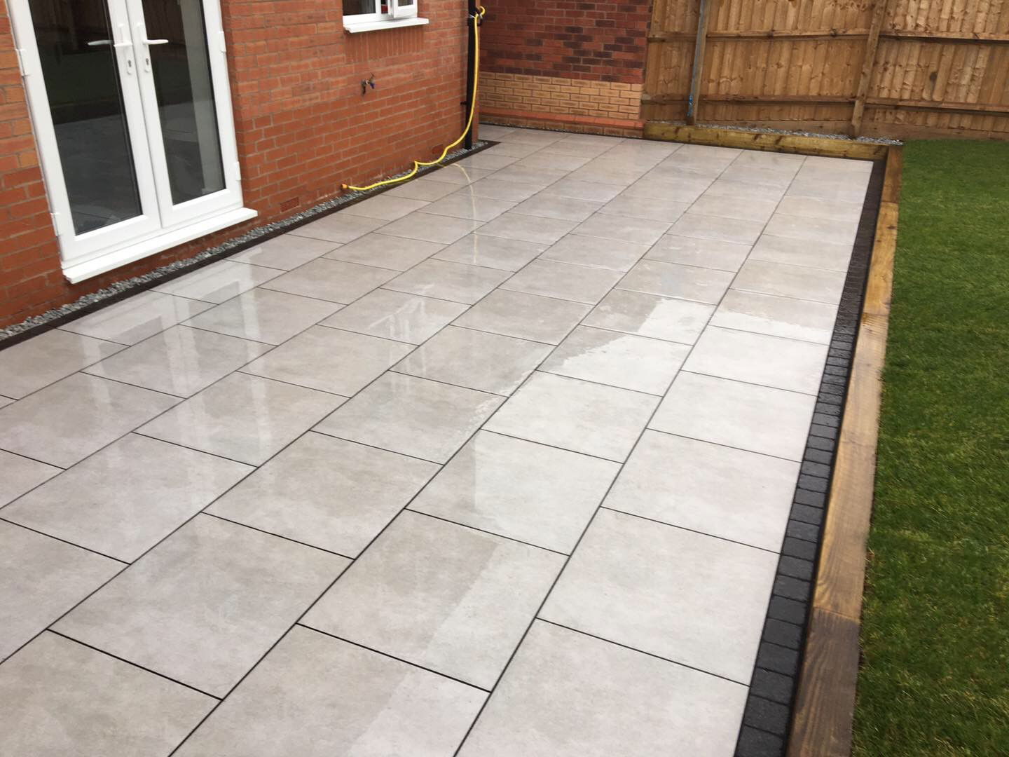 Newstone Grey Porcelain - Lazura - edged with Impala Black Setts - Digby Stone