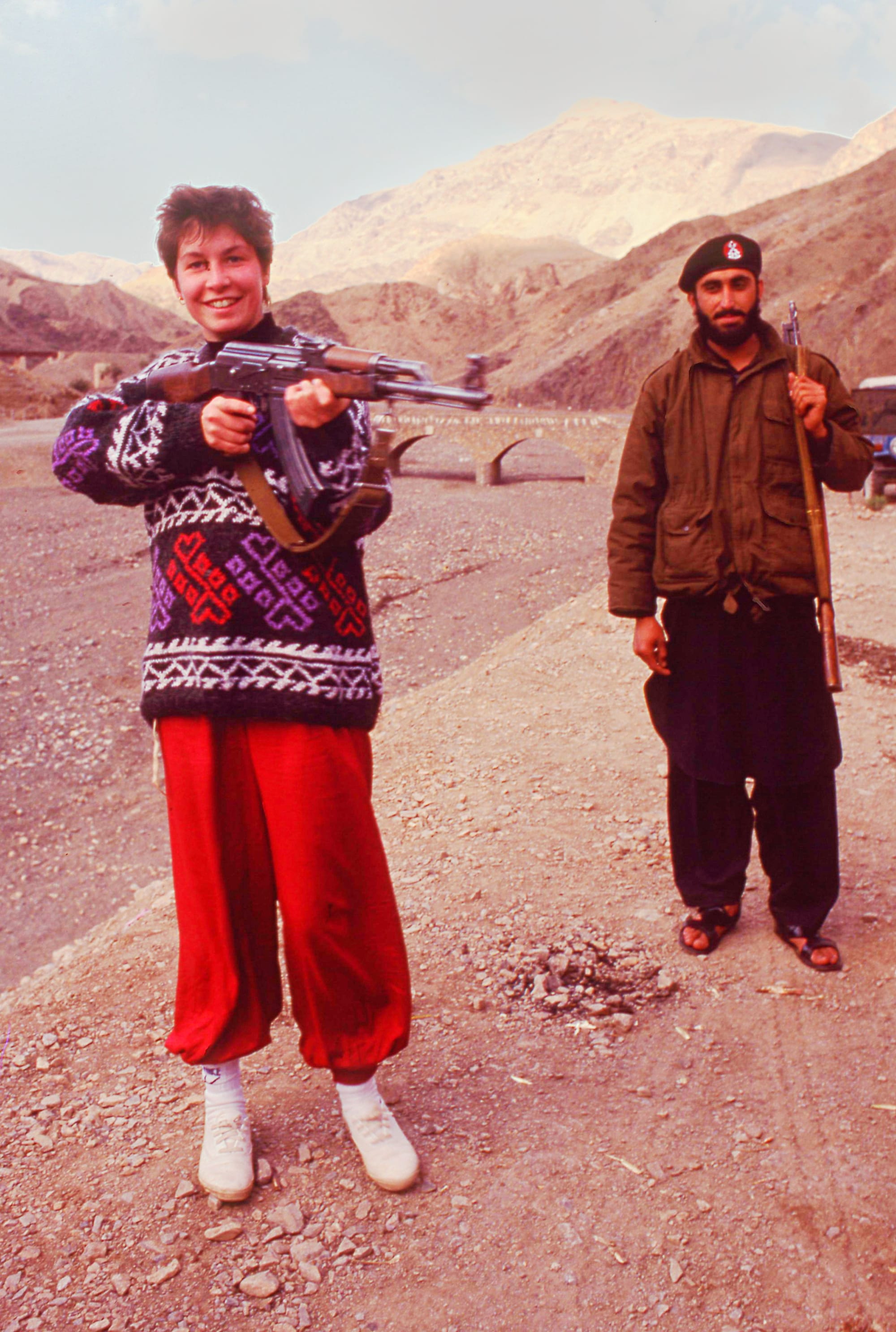 Everybody loves posing with the infamous Kalashnikov AK-47 assault rifle, Afghan Border Region.