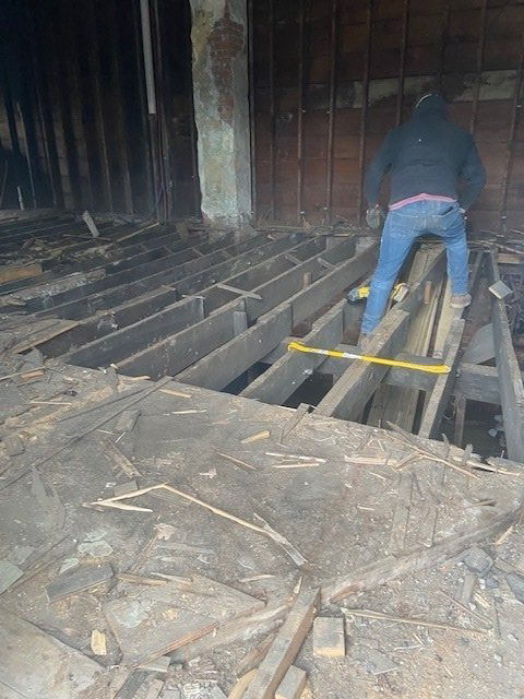 1st floor view - Pulling out old wood flooring