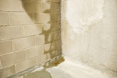 What causes a leaking basement.